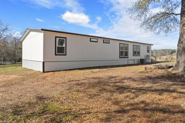 a house view with a backyard space