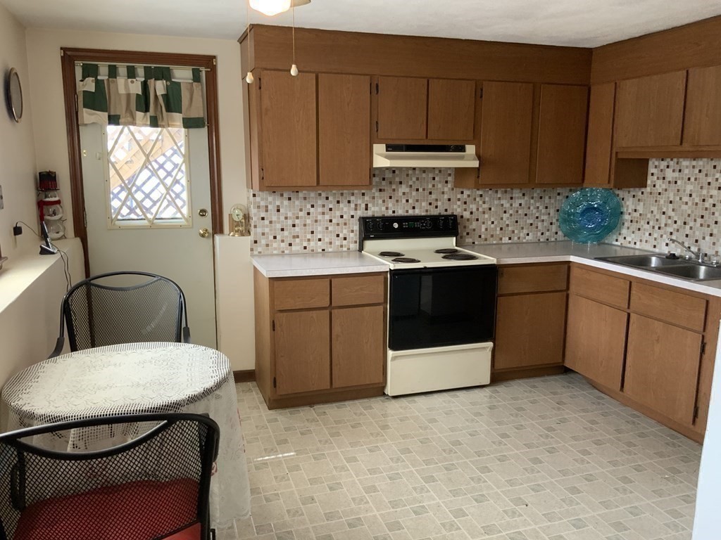44-46 Catalina Road Lynn, MA 01905 - Photo 12 of 28 a kitchen that has a sink and a stove