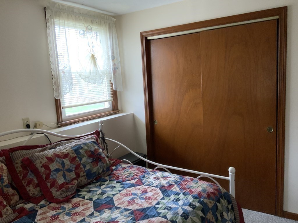 44-46 Catalina Road Lynn, MA 01905 - Photo 19 of 28 a bedroom with a bed and a window