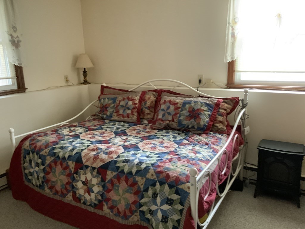 44-46 Catalina Road Lynn, MA 01905 - Photo 20 of 28 a bed sitting in a bedroom next to a window