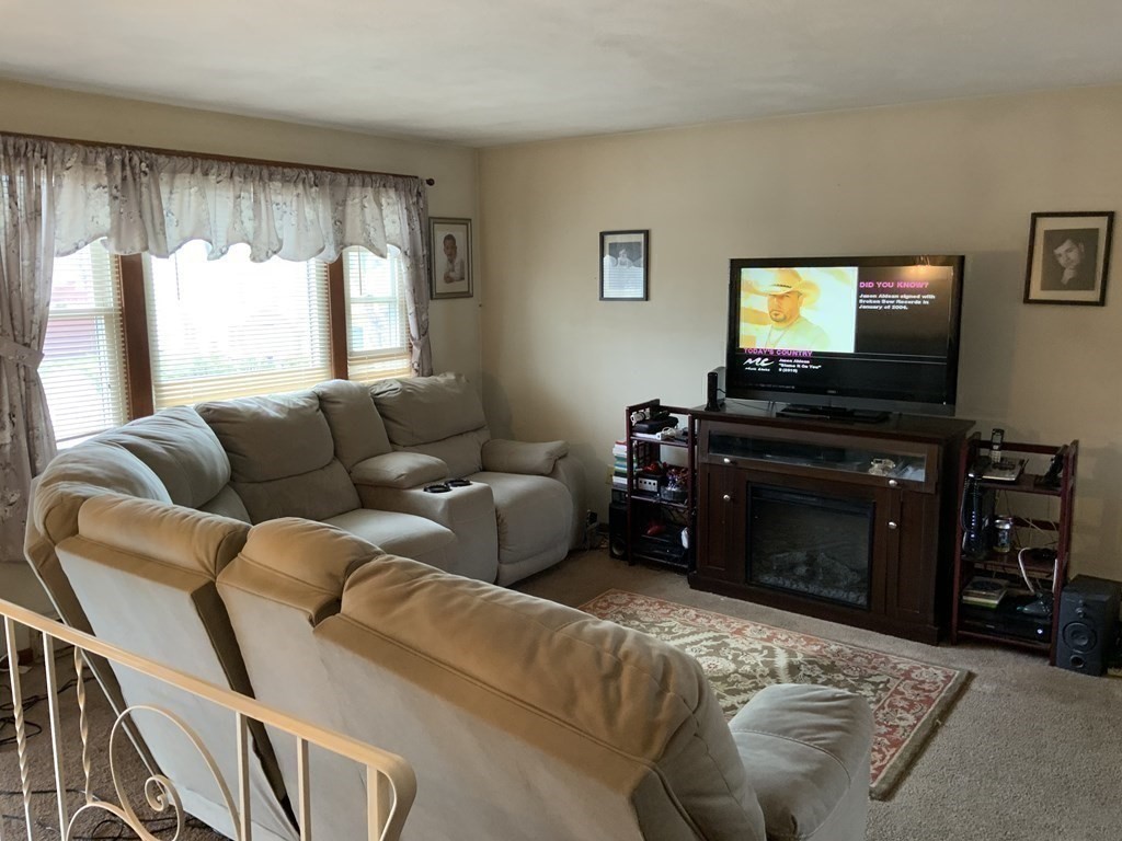 44-46 Catalina Road Lynn, MA 01905 - Photo 24 of 28 a living room with furniture and a flat screen tv