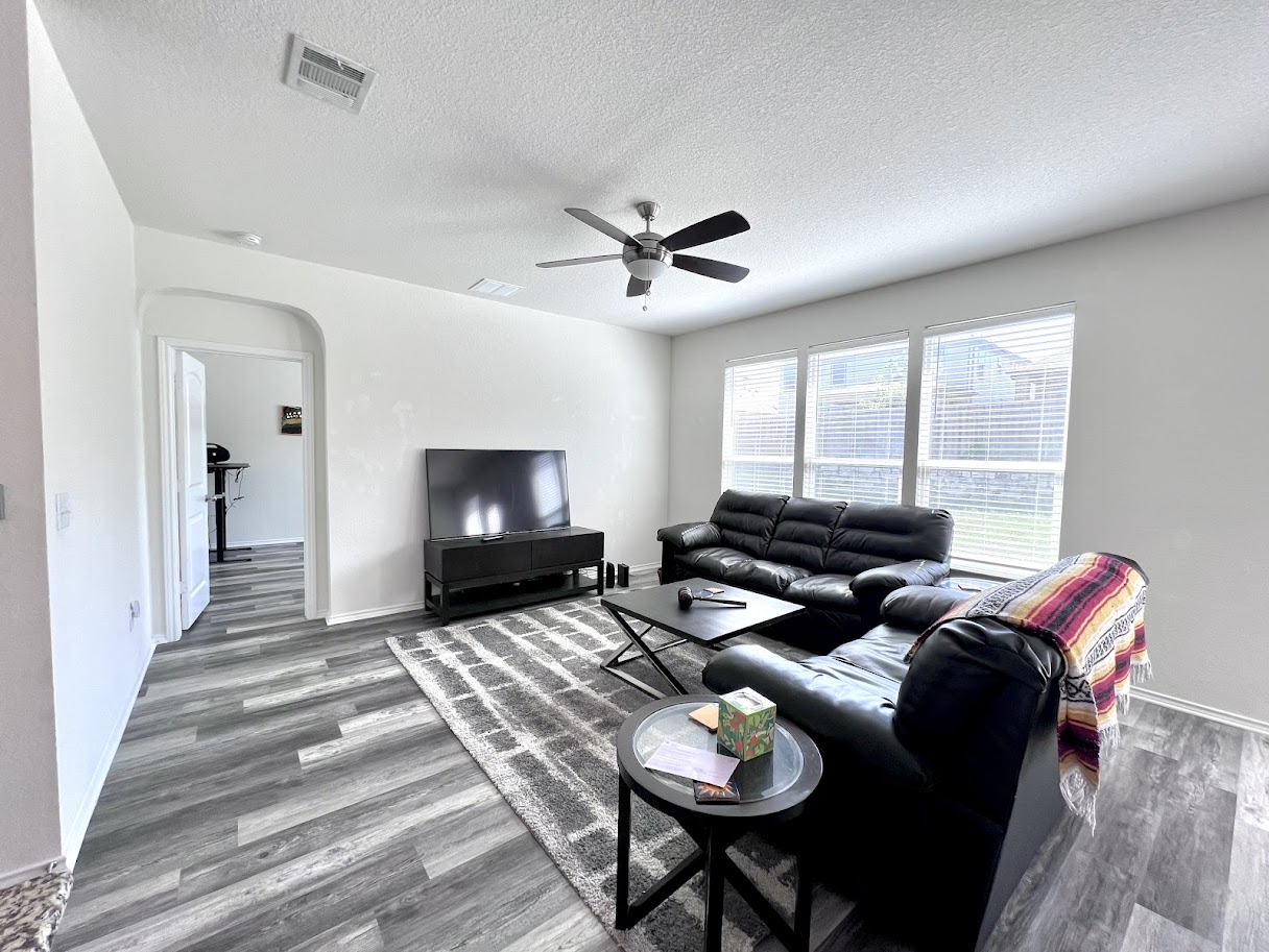 7900 Crystalbrook West Austin, TX 78724 - Photo 20 of 27 a living room with furniture and a ceiling fan