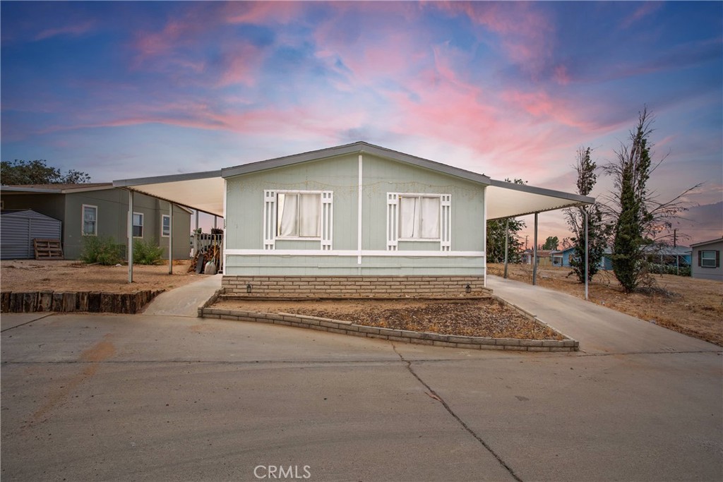 2494 Main Street, Unit 112 Barstow, CA 92311 - Photo 1 of 20 a front view of a house with a outdoor space