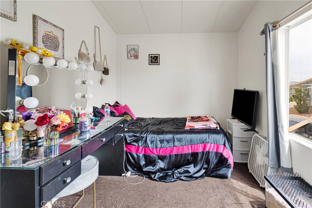 2494 Main Street, Unit 112 Barstow, CA 92311 - Photo 12 of 20 a bedroom with bed and a window