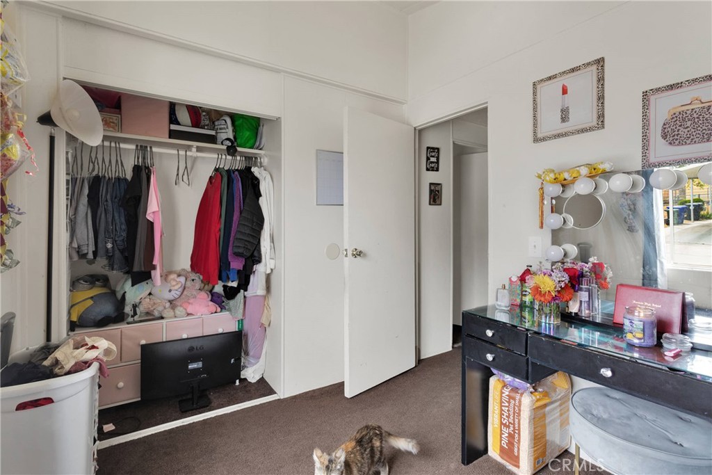 2494 Main Street, Unit 112 Barstow, CA 92311 - Photo 13 of 20 a view of walk in closet with clothes and shoes