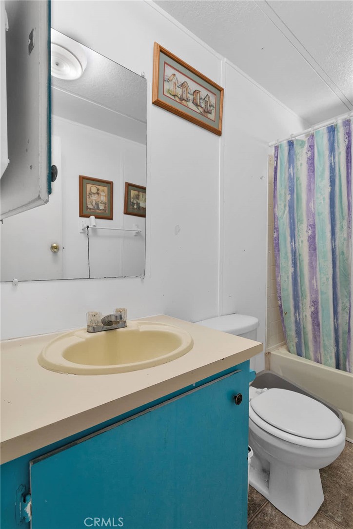 2494 Main Street, Unit 112 Barstow, CA 92311 - Photo 14 of 20 a bathroom with a sink a toilet and shower