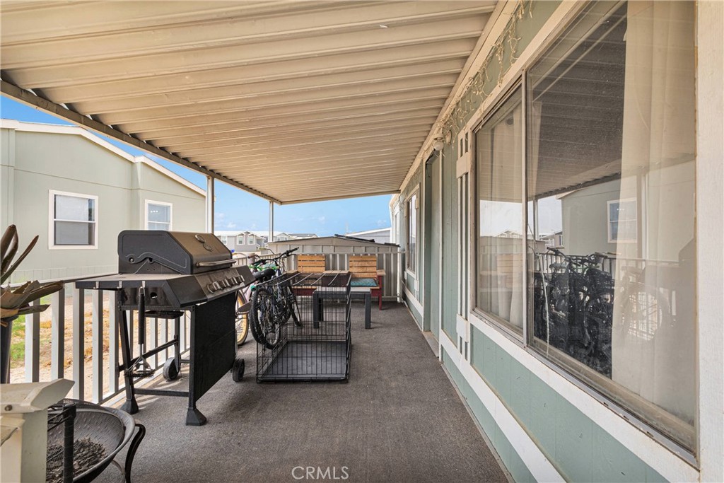 2494 Main Street, Unit 112 Barstow, CA 92311 - Photo 18 of 20 a view of a patio with table and chairs and floor to ceiling window
