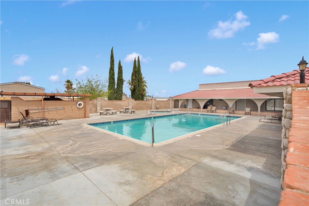 2494 Main Street, Unit 112 Barstow, CA 92311 - Photo 20 of 20 a view of a swimming pool with a patio