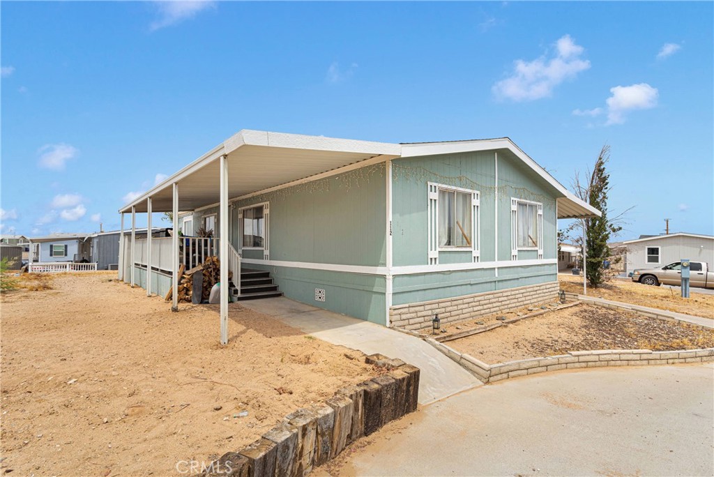 2494 Main Street, Unit 112 Barstow, CA 92311 - Photo 3 of 20 a view of a house with backyard and utility room
