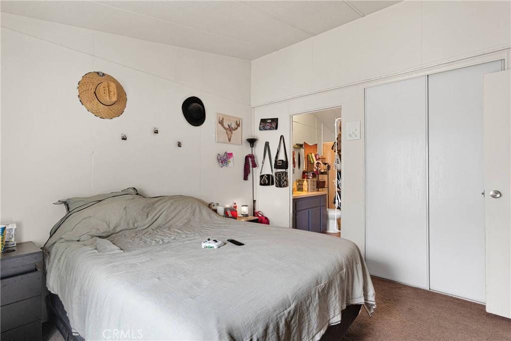 2494 Main Street, Unit 112 Barstow, CA 92311 - Photo 9 of 20 a bedroom with a bed and a window