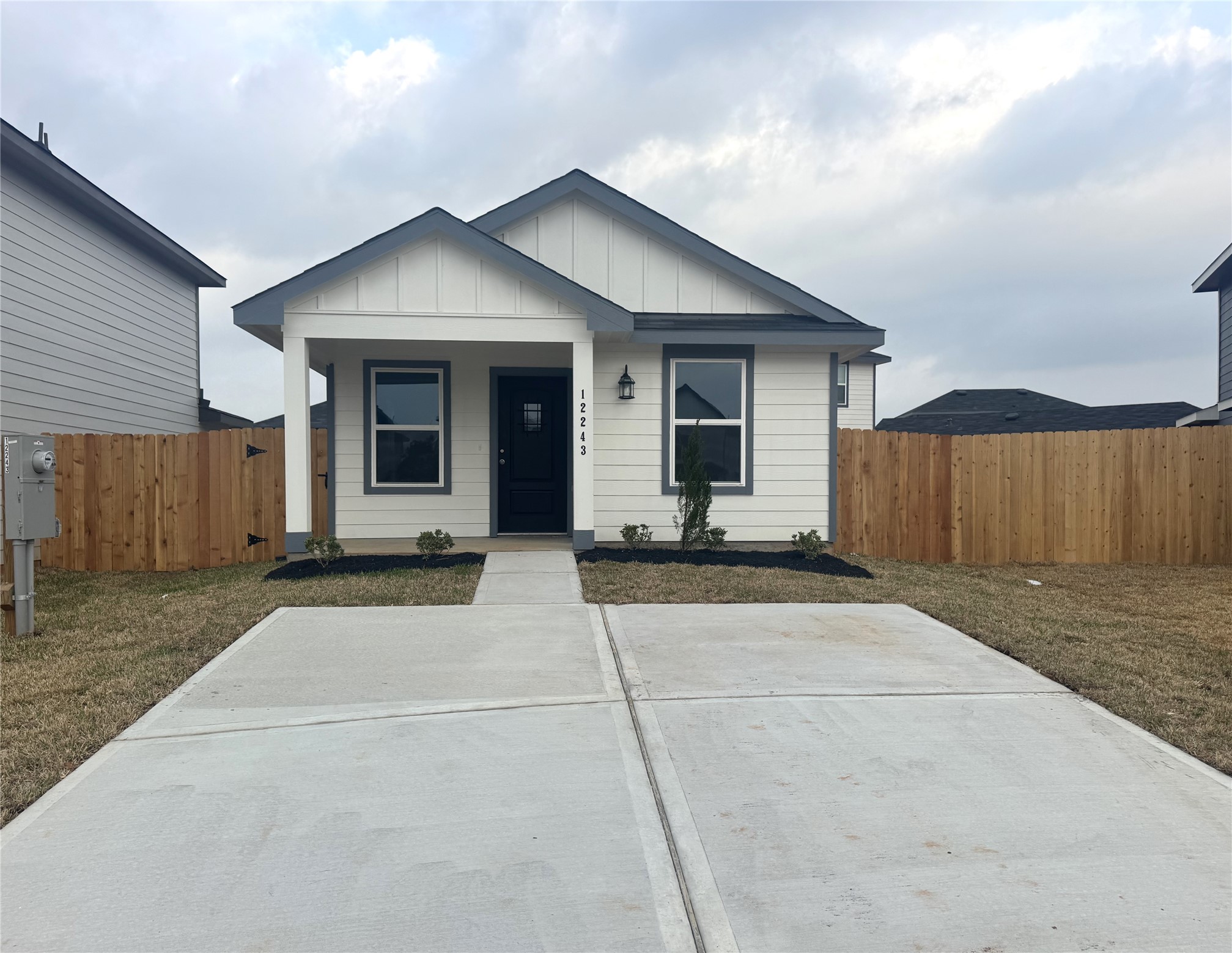 12243 Shield Crest Court Willis, TX 77378 - Photo 2 of 13 a front view of a house with a yard