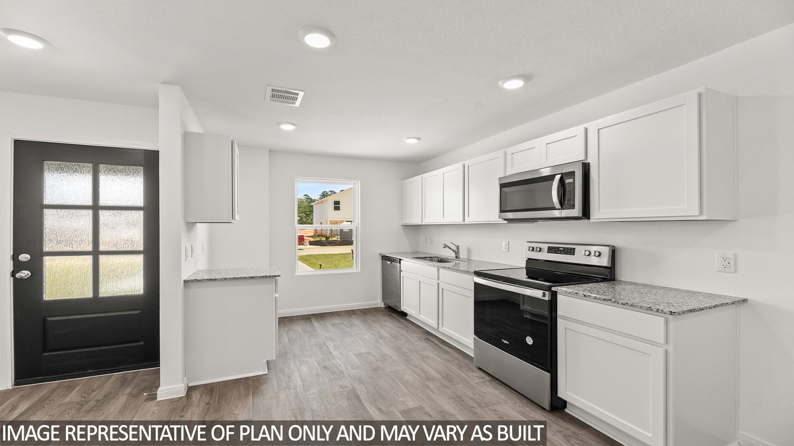 12243 Shield Crest Court Willis, TX 77378 - Photo 3 of 13 a kitchen with stainless steel appliances granite countertop a stove a sink and a refrigerator