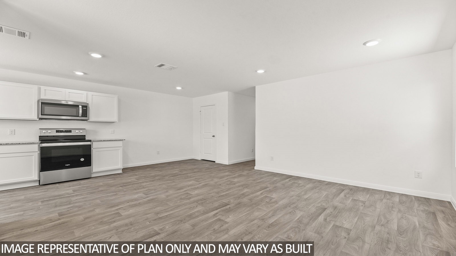 12243 Shield Crest Court Willis, TX 77378 - Photo 7 of 13 a view of kitchen with microwave and stove top oven