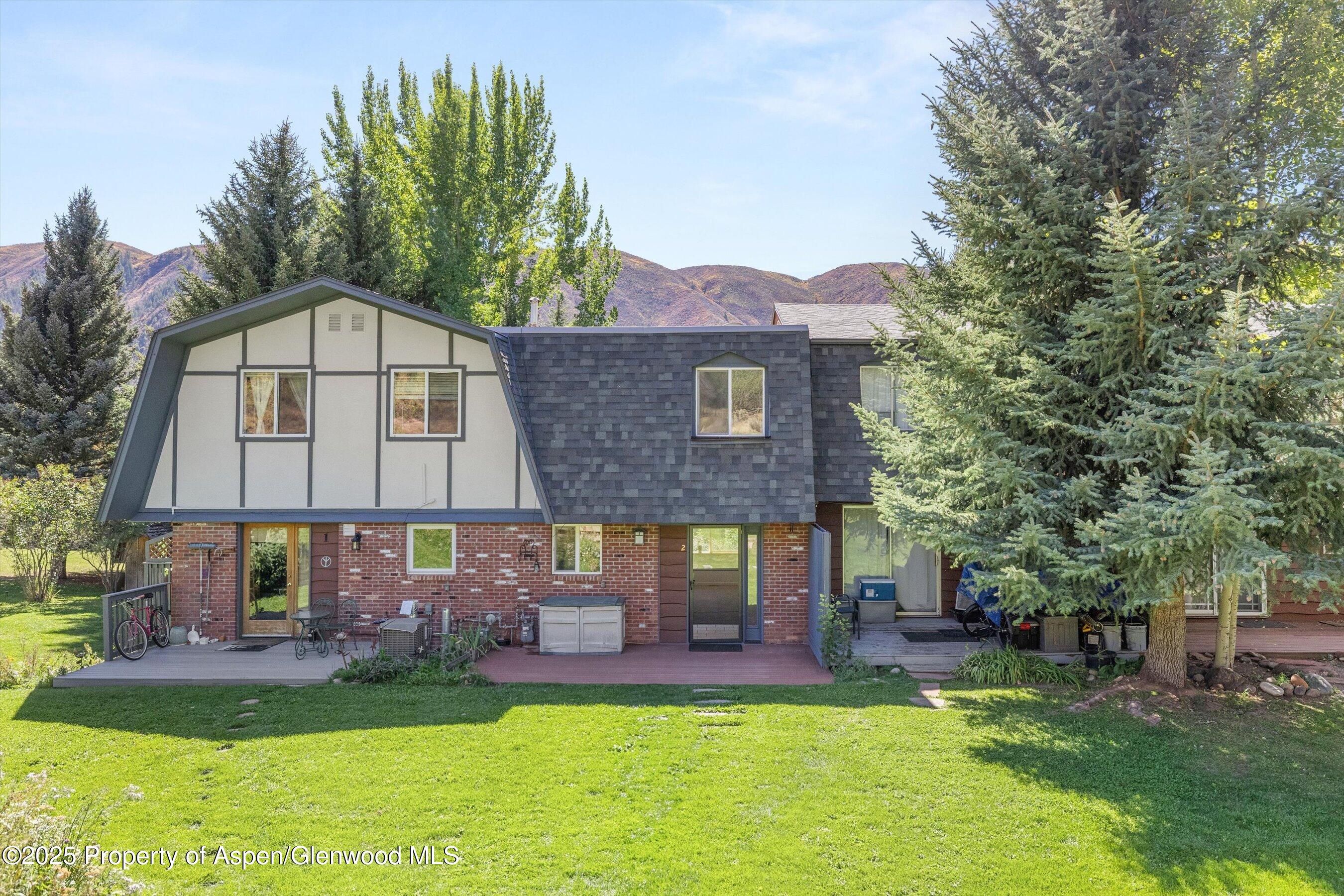 331 Holland Hills Road, Unit 2 Basalt, CO 81621 - Photo 3 of 13 a view of a house with a yard