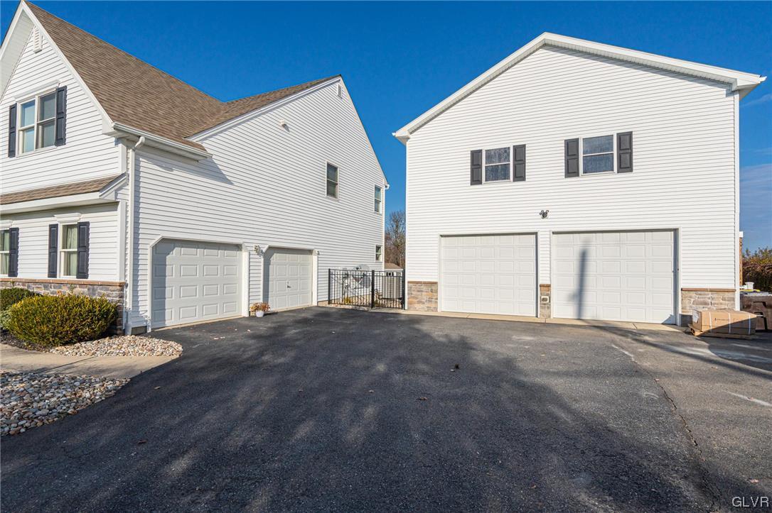 1240 Miller Road Wind Gap, PA 18091 - Photo 2 of 48 a front view of a house with a yard and garage