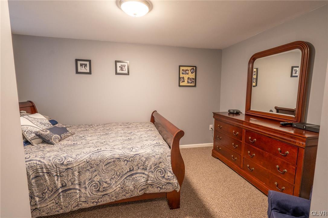 1240 Miller Road Wind Gap, PA 18091 - Photo 40 of 48 a bedroom with a bed and a mirror on dresser