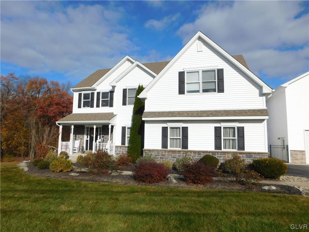 1240 Miller Road Wind Gap, PA 18091 - Photo 5 of 48 a front view of a house with a yard