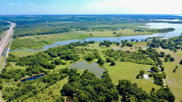 a view of a field with an ocean