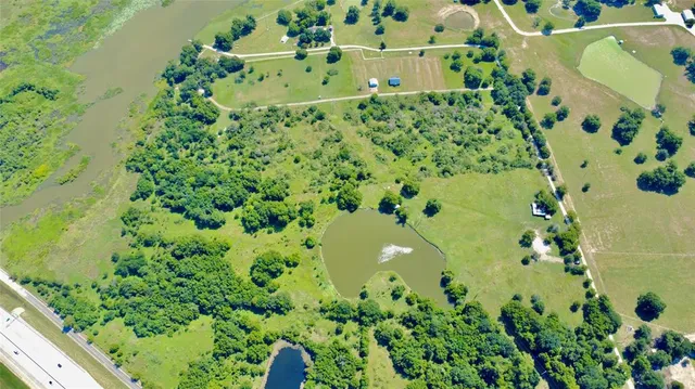 a view of a field with an ocean