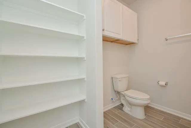 a bathroom with a toilet and a view