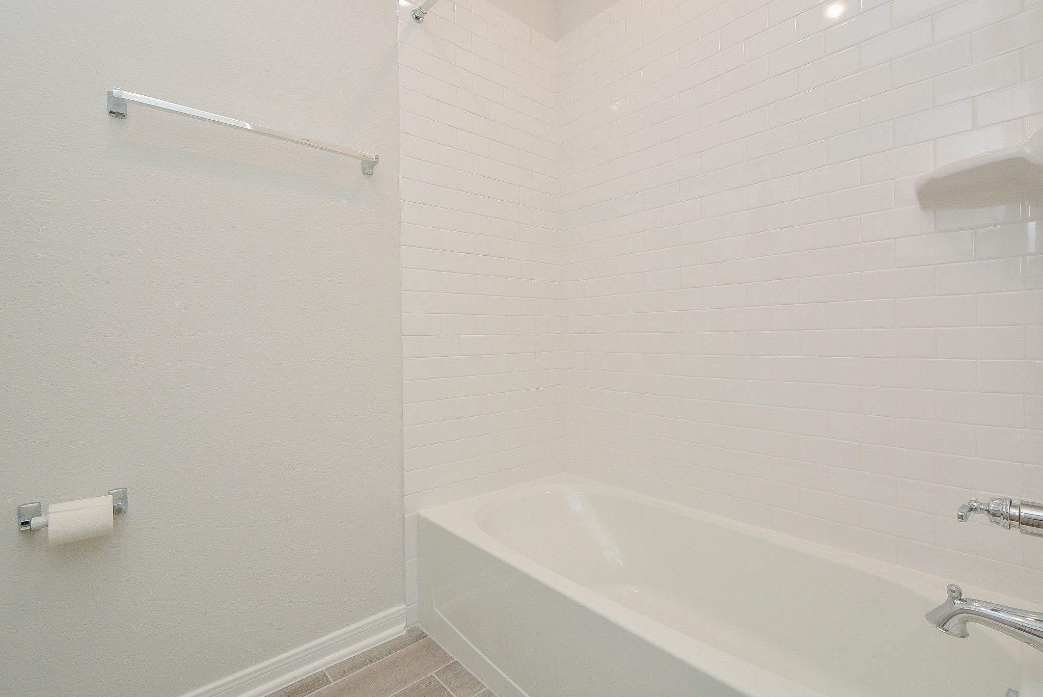 8634 Herring Lane Cypress, TX 77433 - Photo 13 of 50 a bathroom with a bathtub
