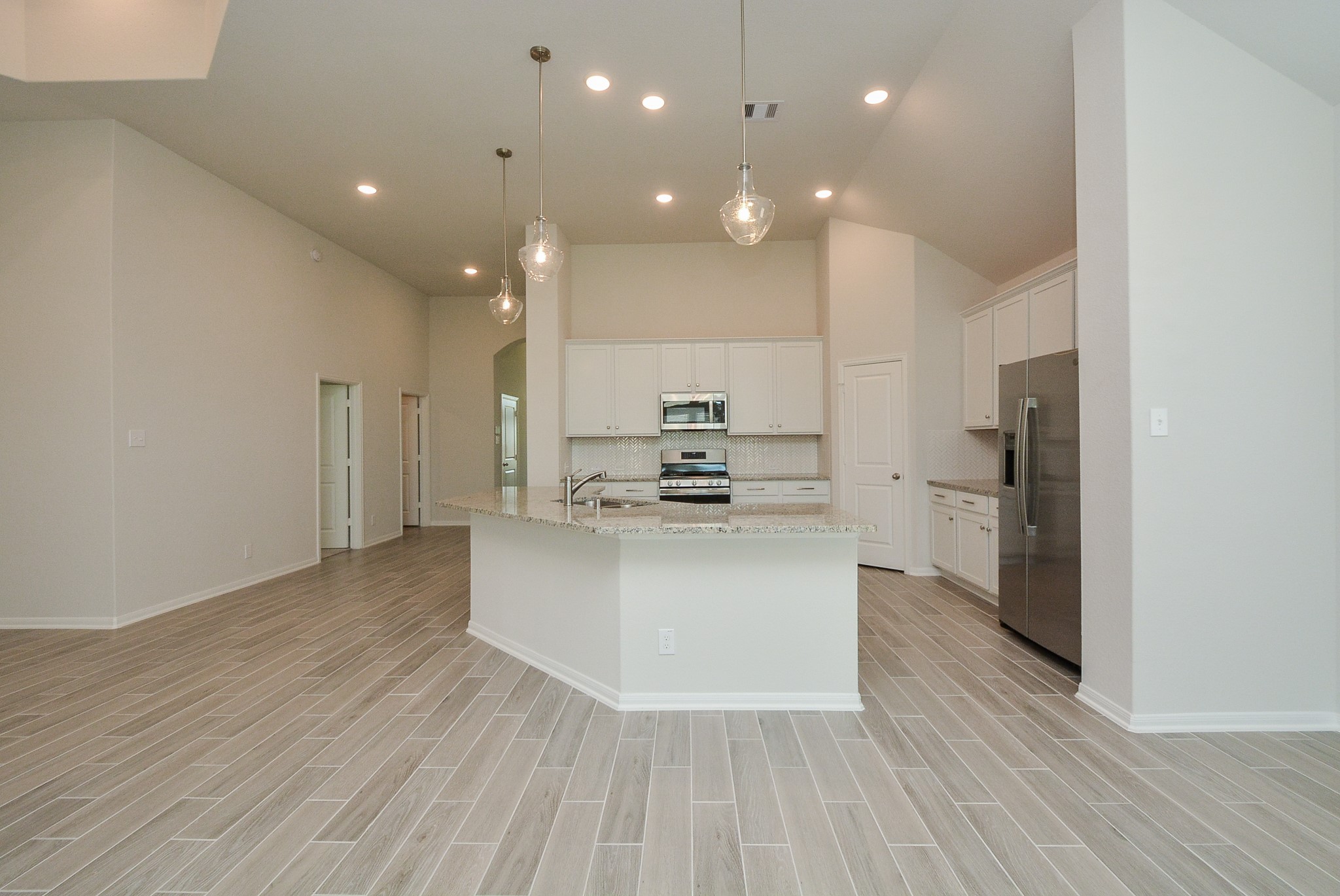 8634 Herring Lane Cypress, TX 77433 - Photo 19 of 50 a view of kitchen with cabinets and stainless steel appliances