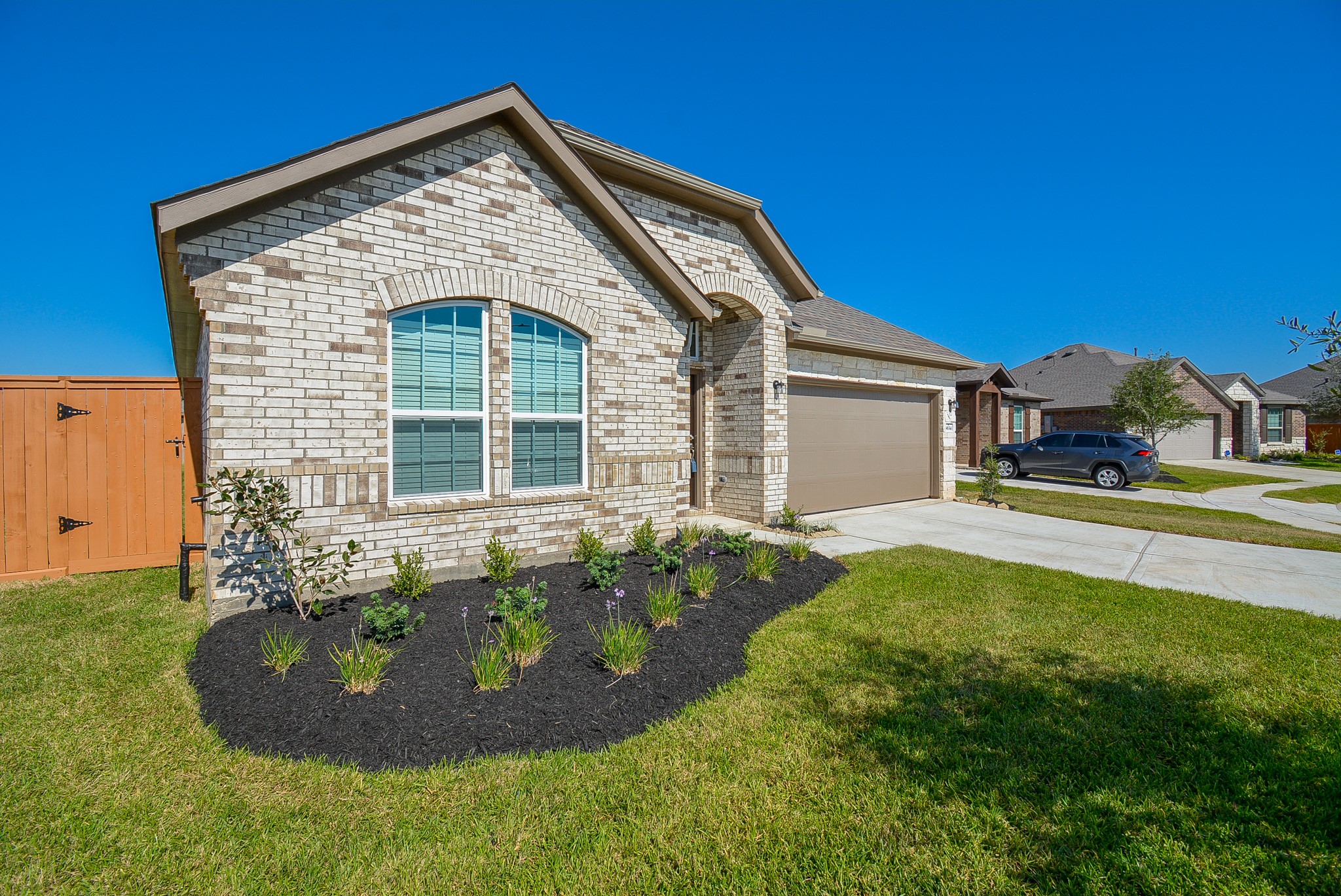 8634 Herring Lane Cypress, TX 77433 - Photo 2 of 50 a front view of a house with a garden