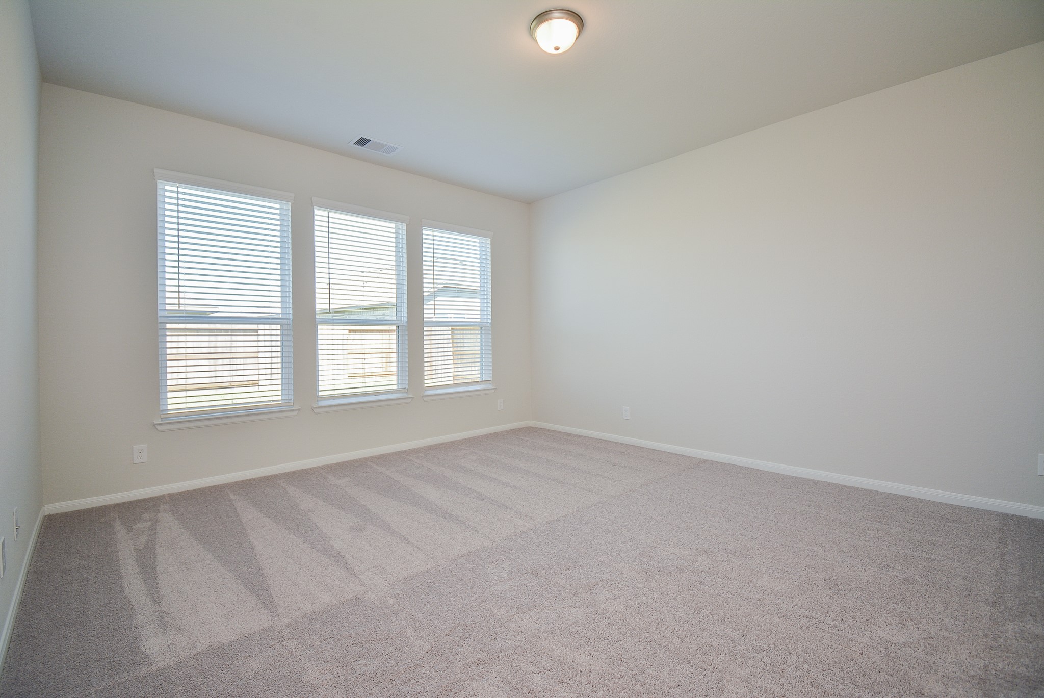 8634 Herring Lane Cypress, TX 77433 - Photo 28 of 50 an empty room with windows