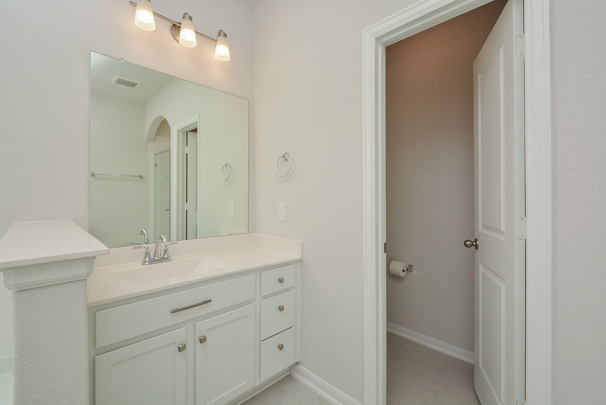 8634 Herring Lane Cypress, TX 77433 - Photo 31 of 50 a bathroom with a sink and a mirror
