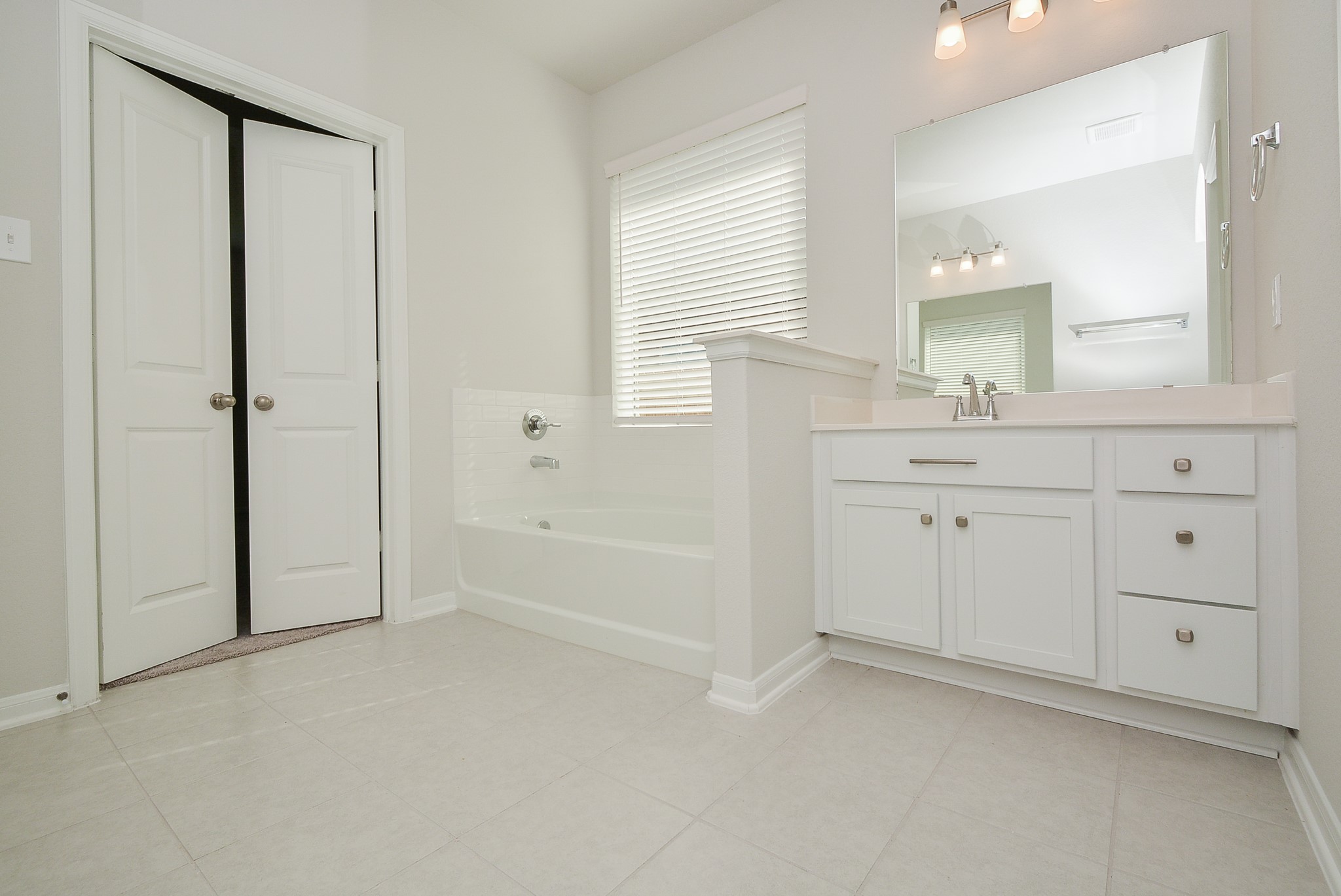 8634 Herring Lane Cypress, TX 77433 - Photo 34 of 50 a bathroom with a sink and a mirror