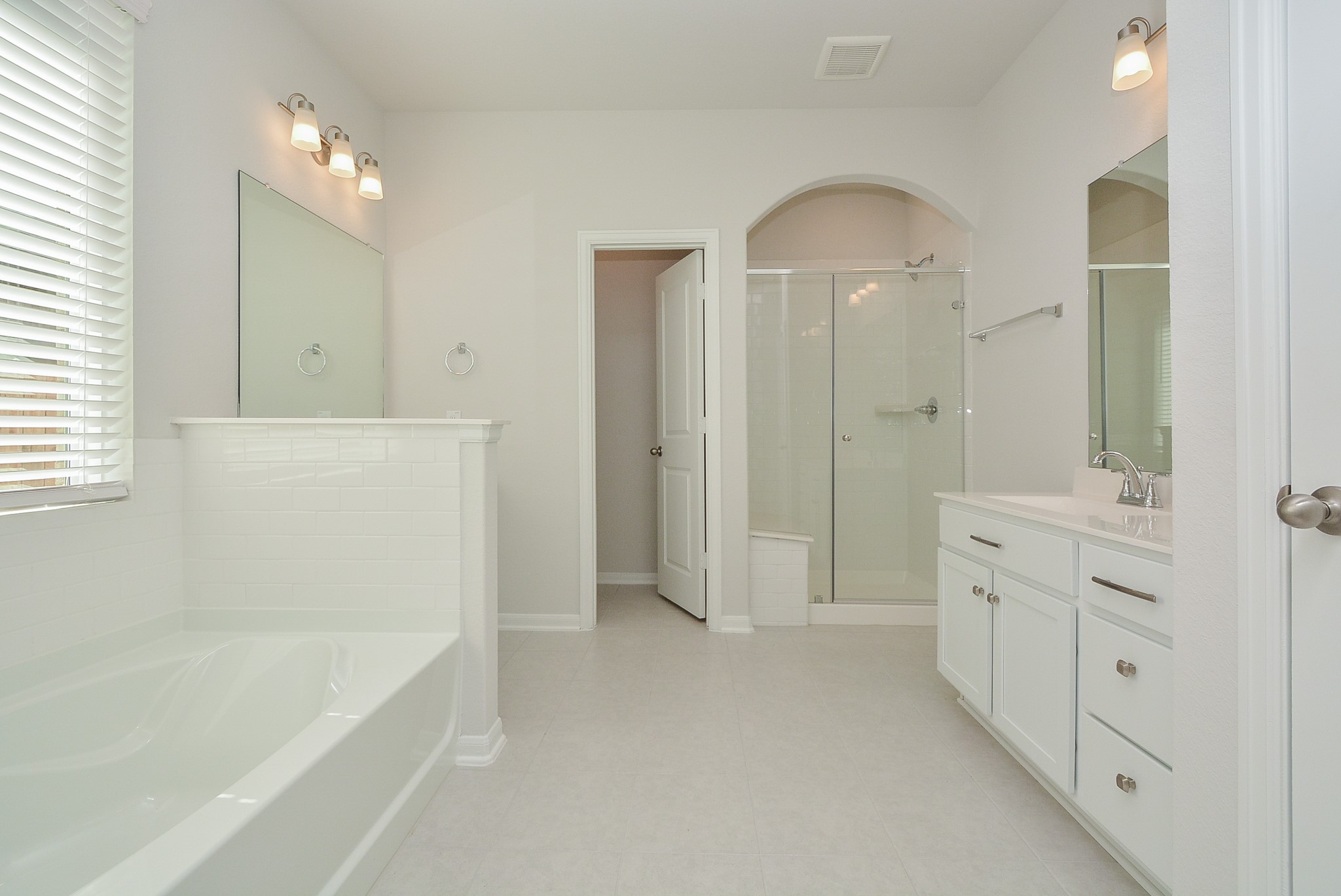 8634 Herring Lane Cypress, TX 77433 - Photo 35 of 50 a spacious bathroom with a tub shower and sink