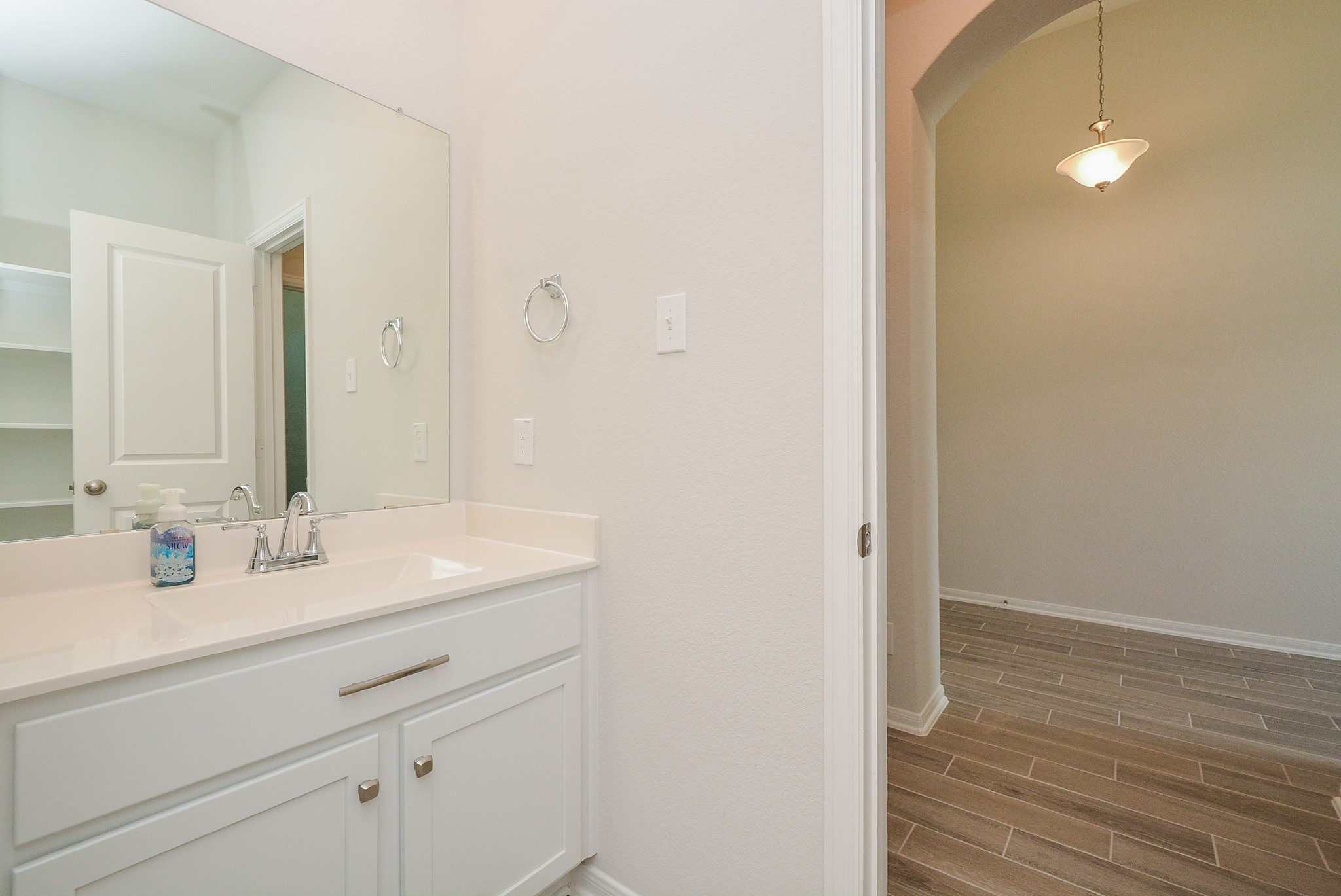 8634 Herring Lane Cypress, TX 77433 - Photo 37 of 50 a bathroom with a sink and a mirror