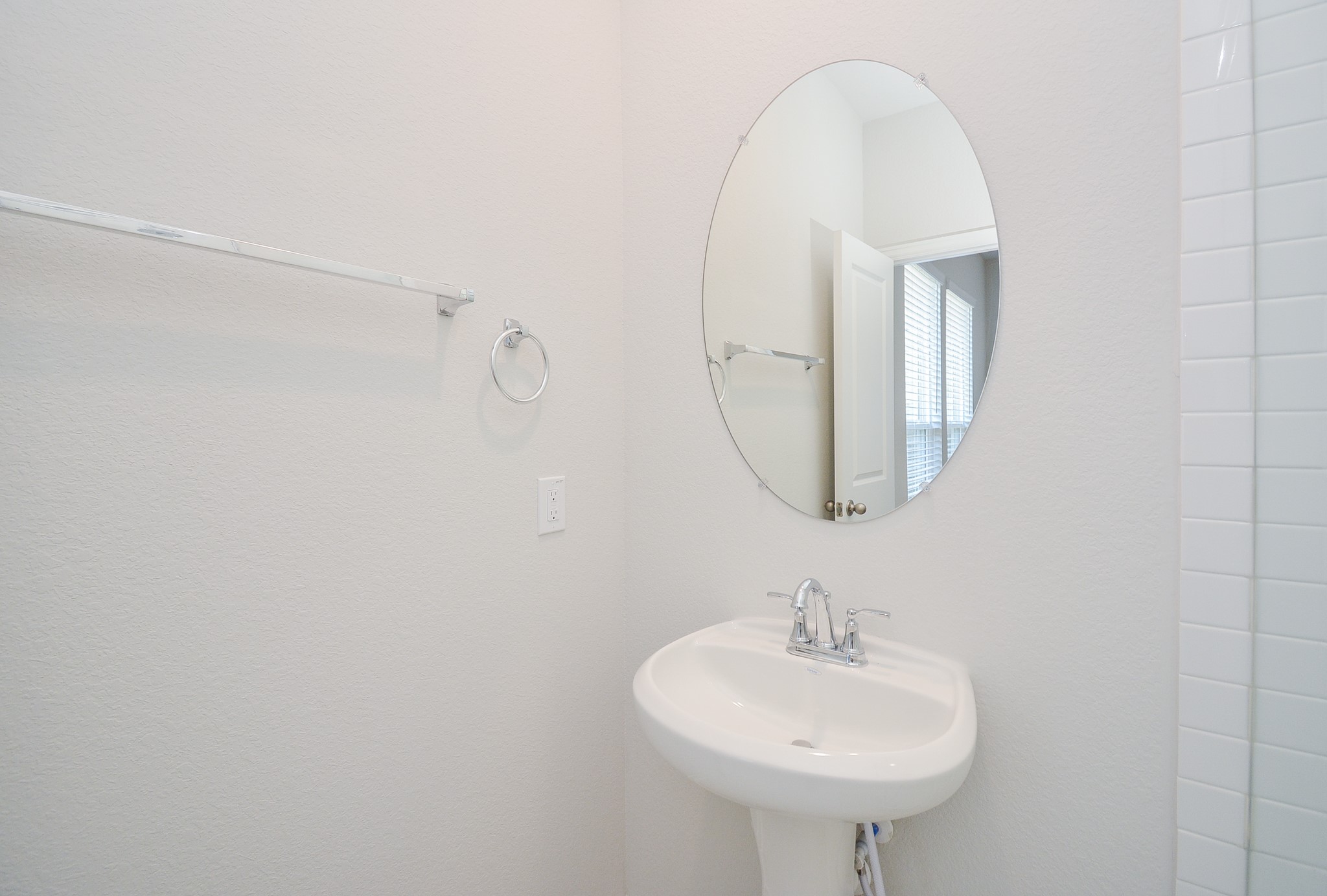 8634 Herring Lane Cypress, TX 77433 - Photo 39 of 50 a bathroom with a sink and a mirror