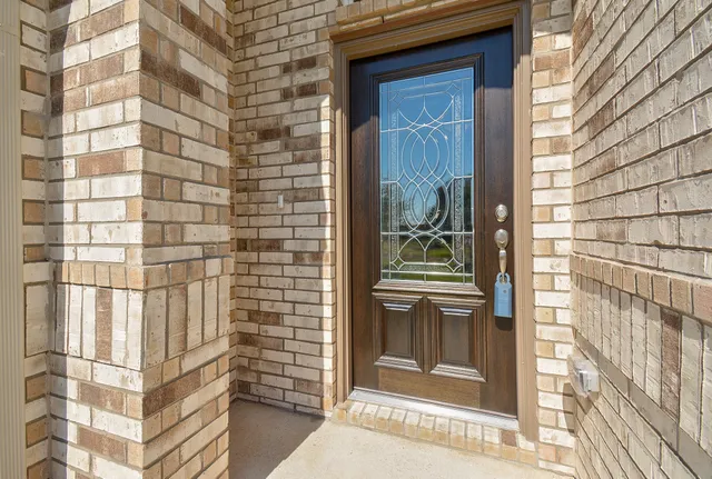 a view of a brick wall of the house