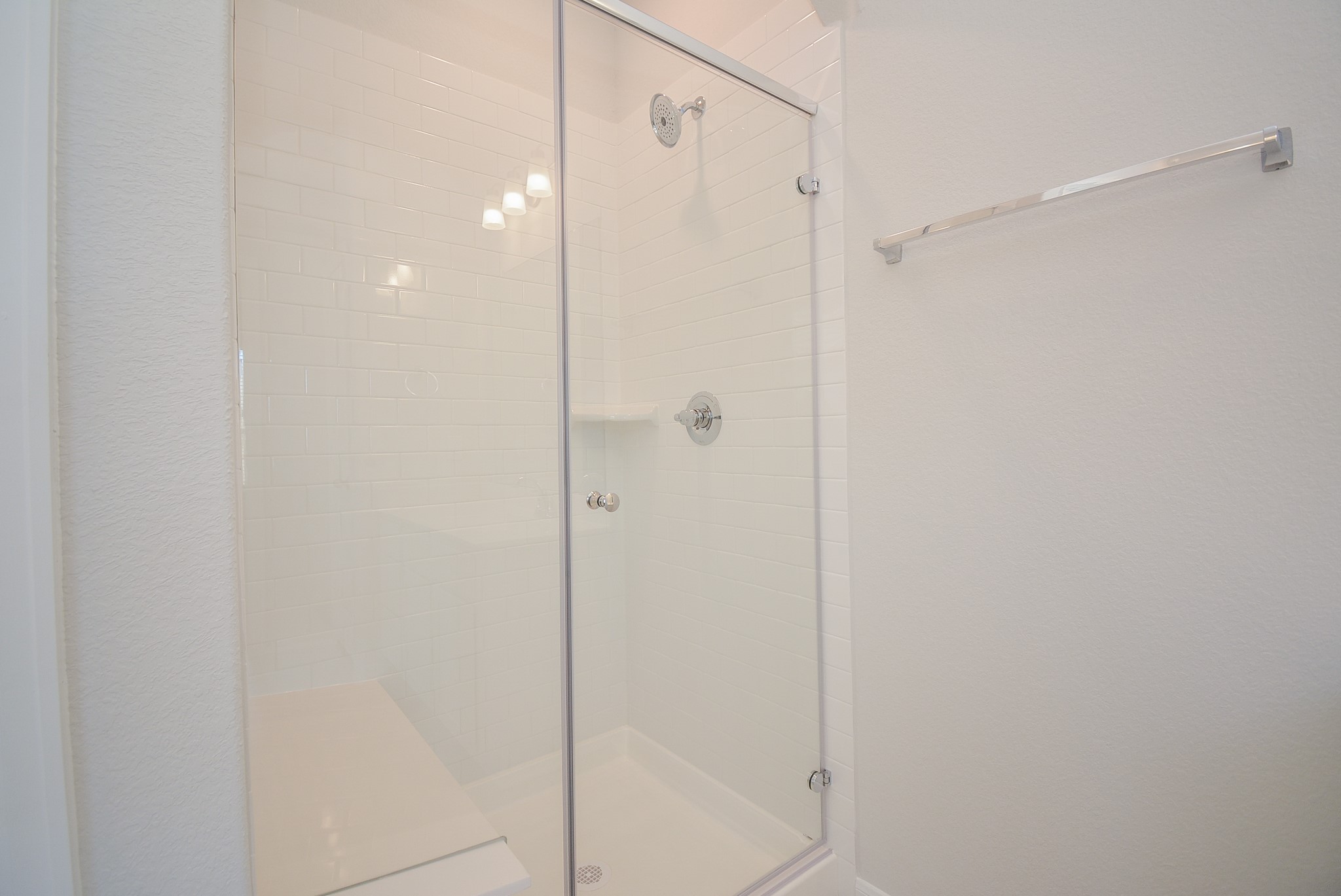 8634 Herring Lane Cypress, TX 77433 - Photo 41 of 50 a bathroom with a shower and a glass door