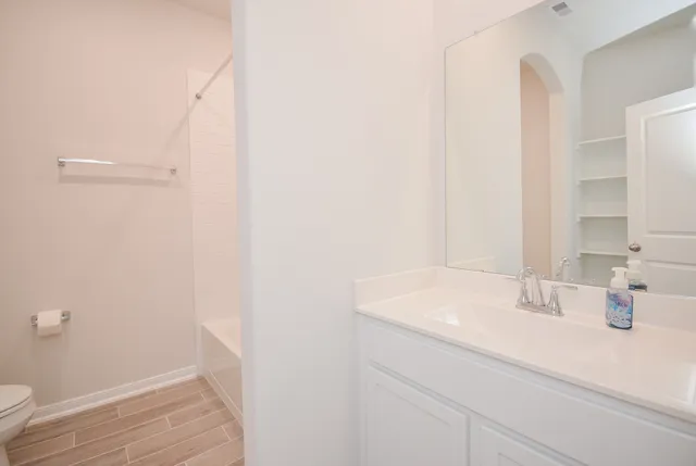 a utility room with sink washer and dryer