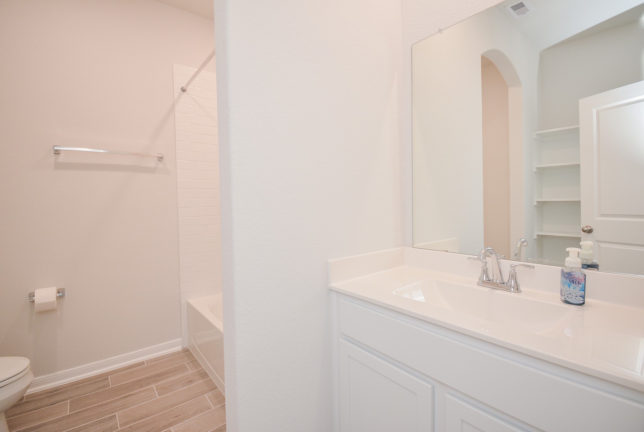 8634 Herring Lane Cypress, TX 77433 - Photo 43 of 50 a bathroom with a sink and a mirror
