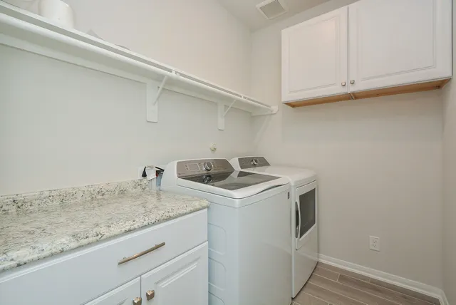 a utility room with sink washer and dryer