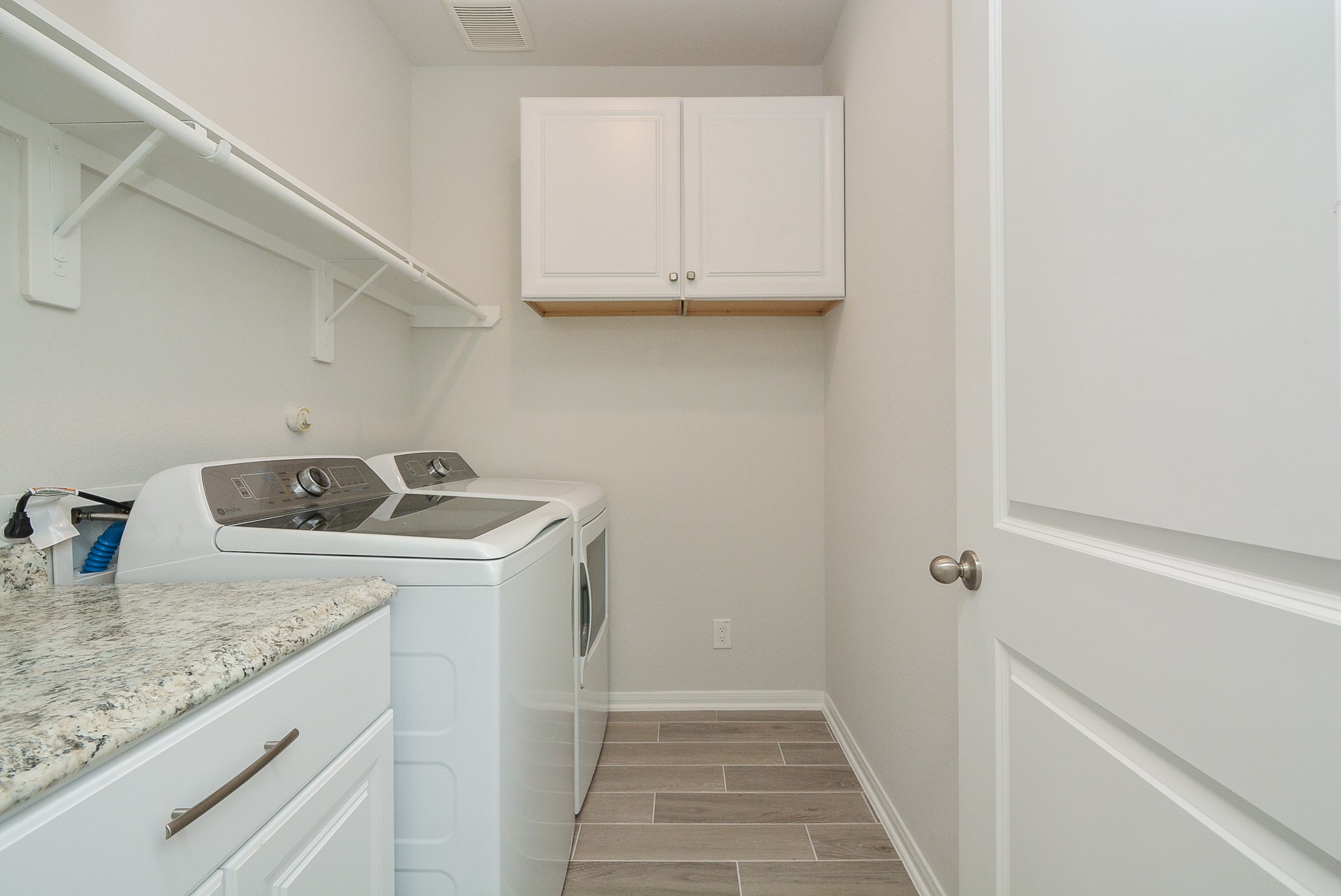 8634 Herring Lane Cypress, TX 77433 - Photo 45 of 50 a utility room with sink washer and dryer