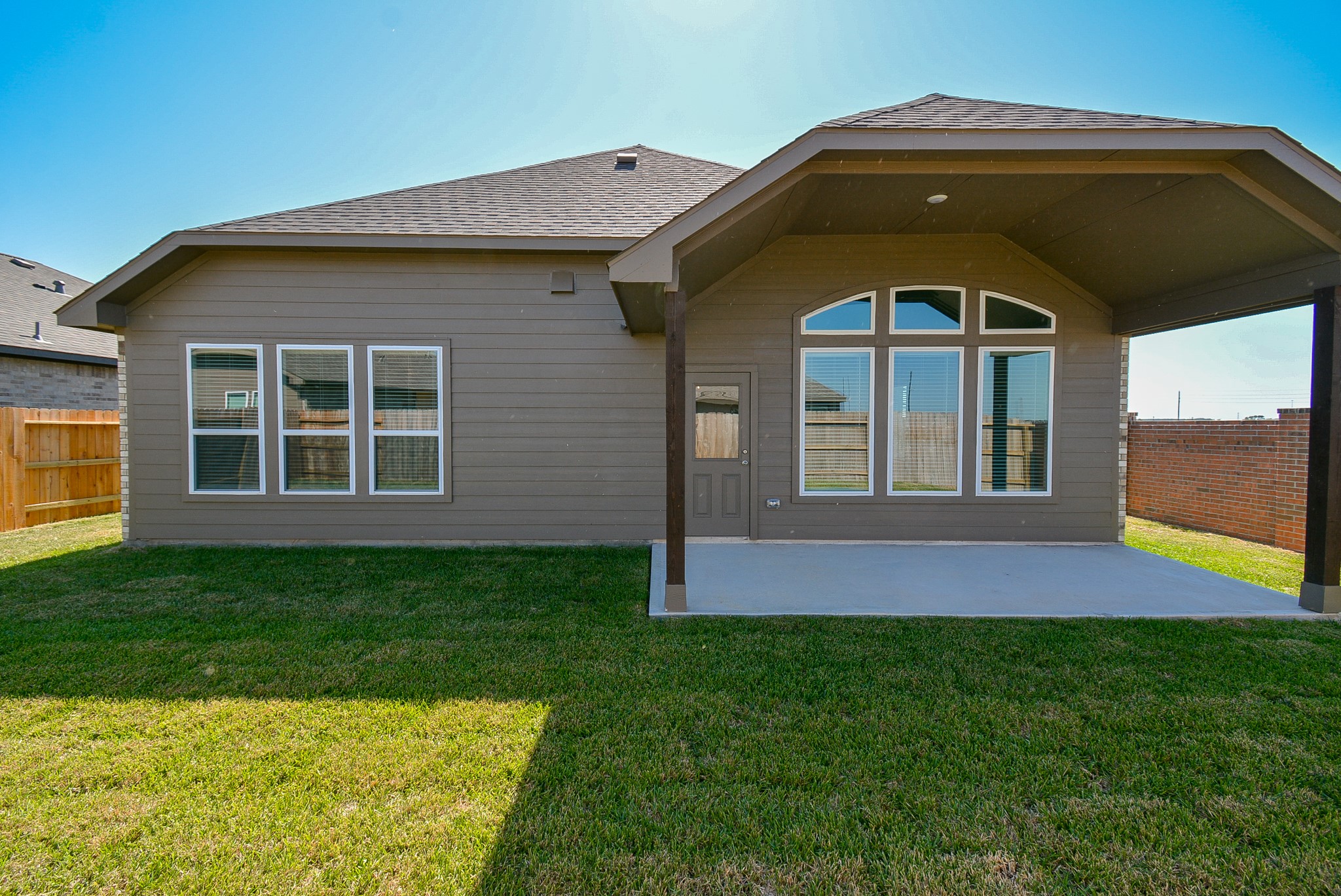 8634 Herring Lane Cypress, TX 77433 - Photo 48 of 50 a front view of a house with a yard