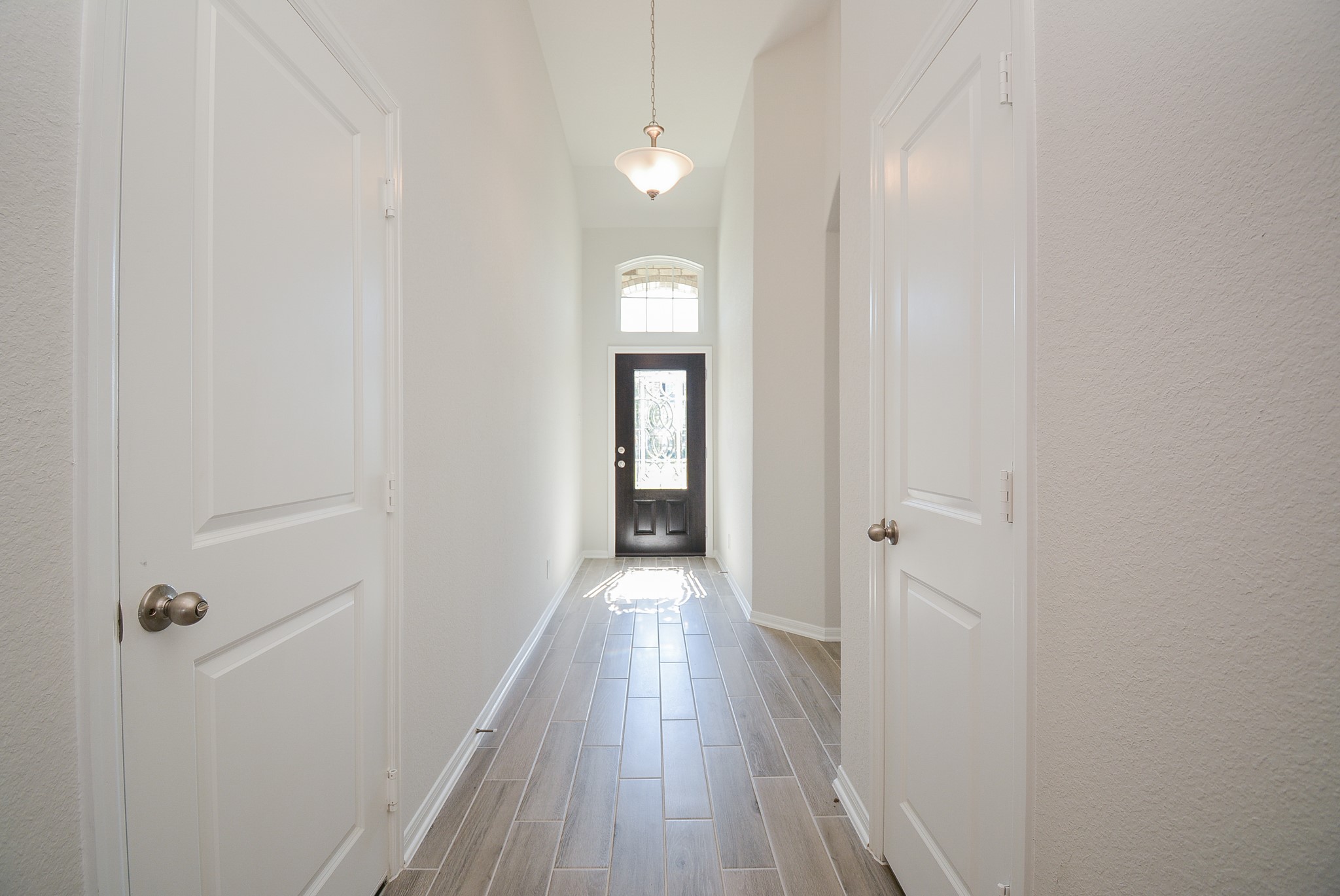 8634 Herring Lane Cypress, TX 77433 - Photo 5 of 50 a view of entryway with wooden floor