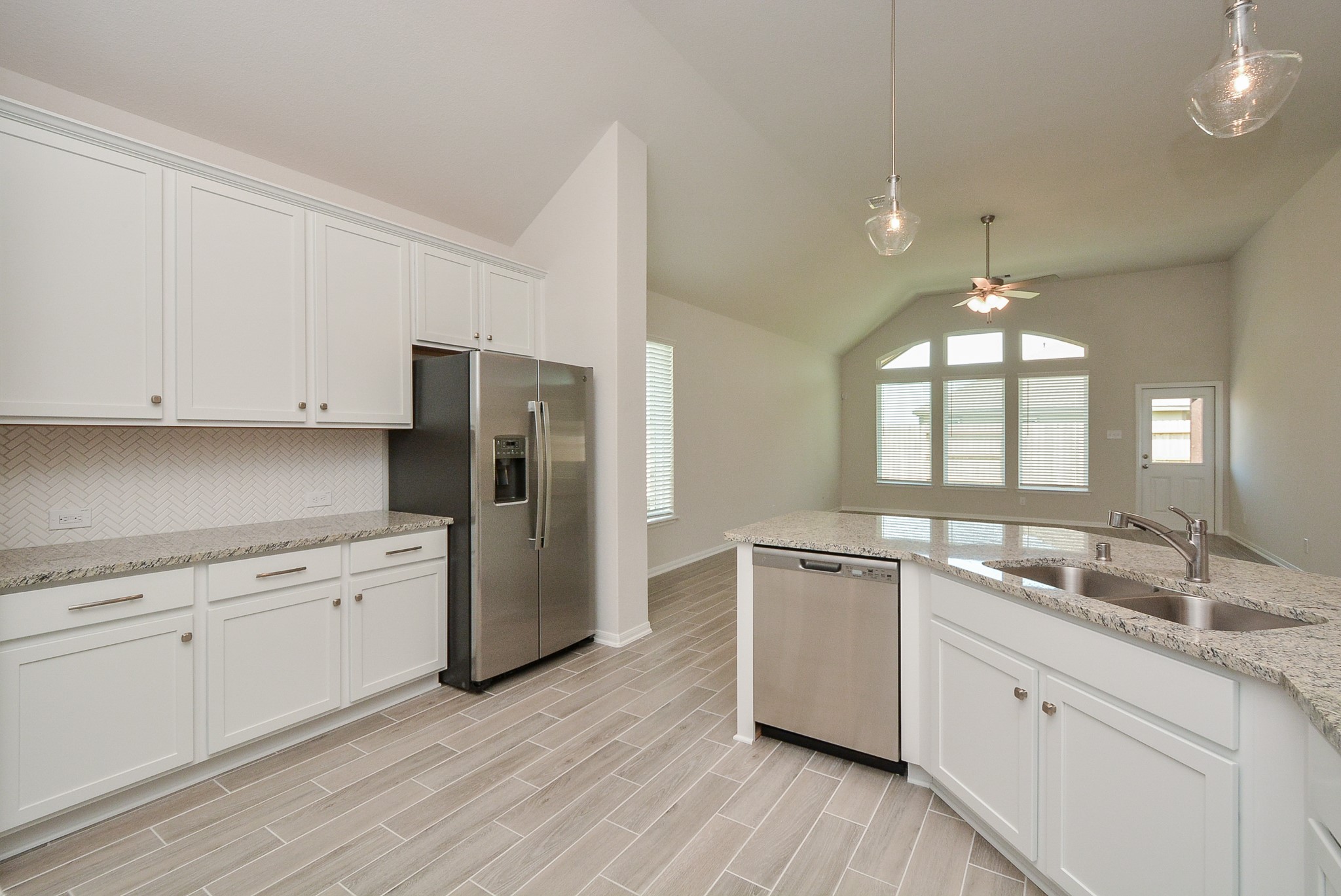 8634 Herring Lane Cypress, TX 77433 - Photo 7 of 50 a kitchen with a sink stove and refrigerator