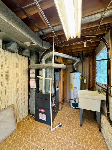 a house view with a sitting space and garden