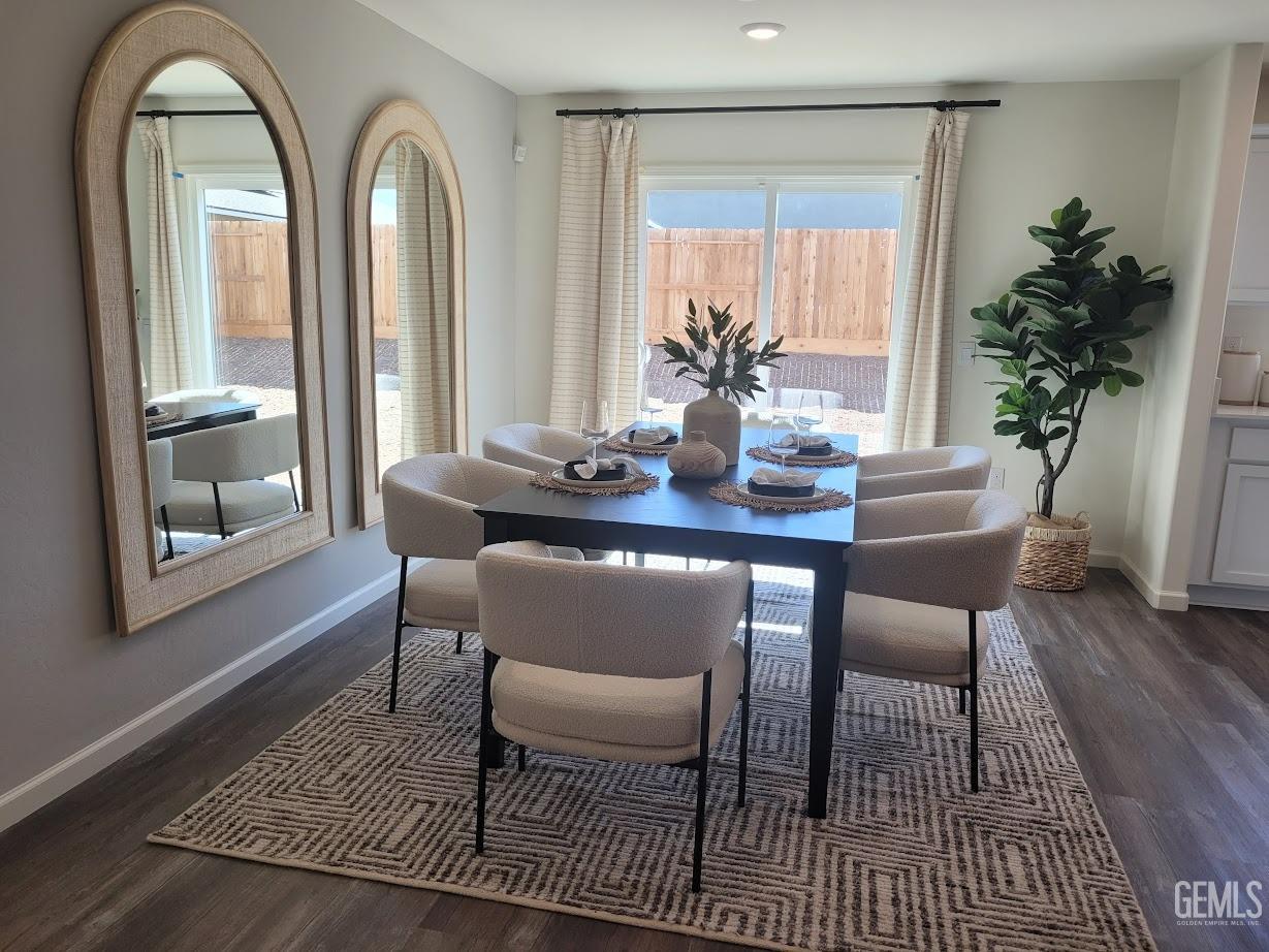 Undisclosed Address Bakersfield, CA 93307 - Photo 13 of 23 a dining room with furniture window and wooden floor