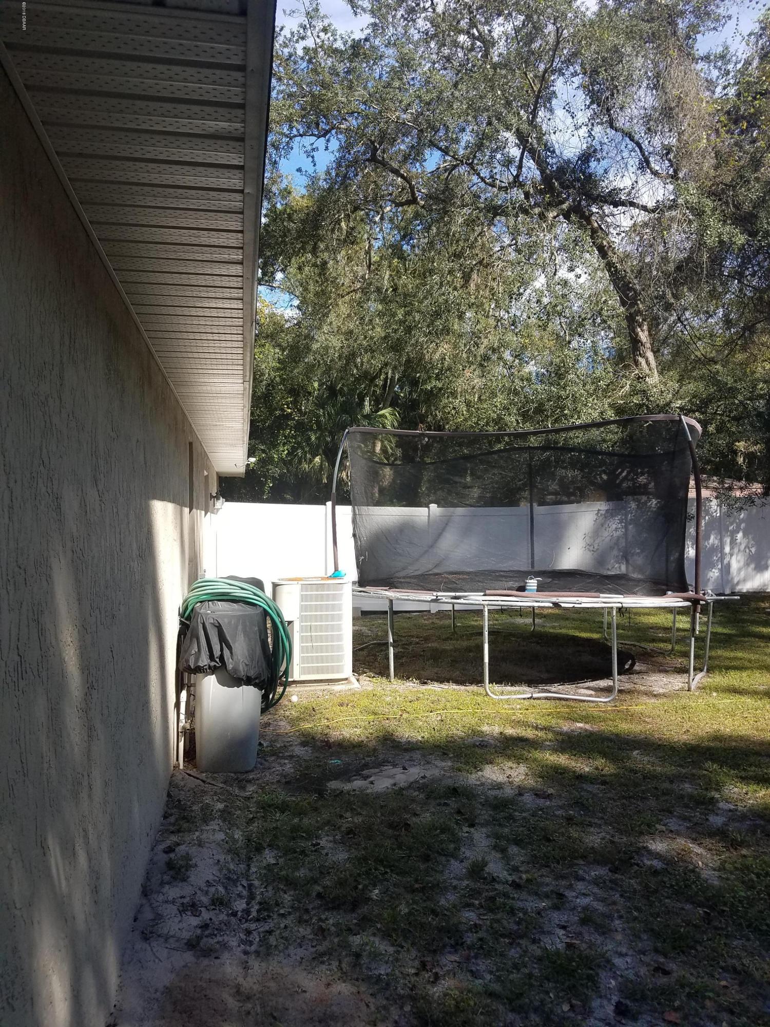 130 Matanzas Road DeBary, FL 32713 - Photo 12 of 25 Left Rear Trampoline