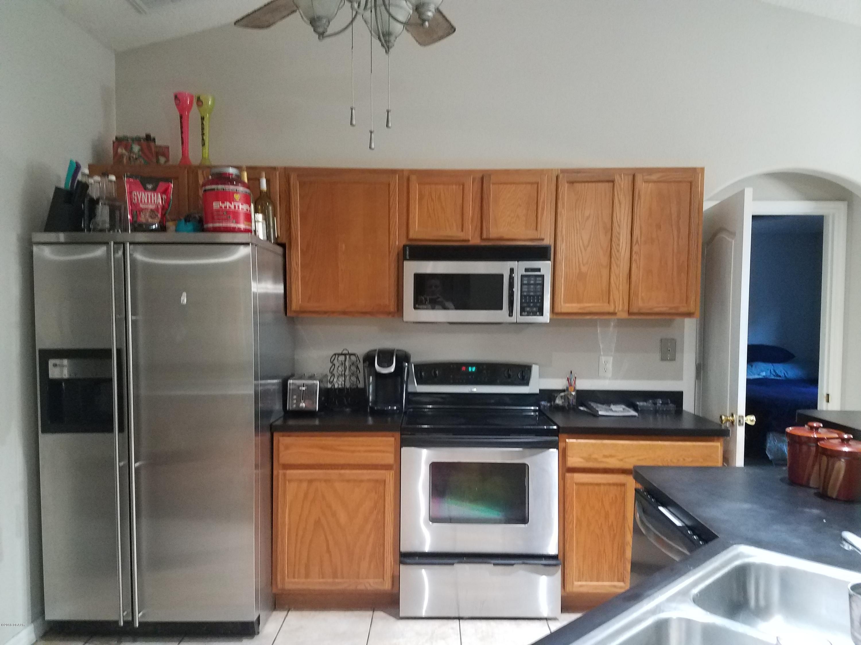 130 Matanzas Road DeBary, FL 32713 - Photo 21 of 25 Range Refrig Wall