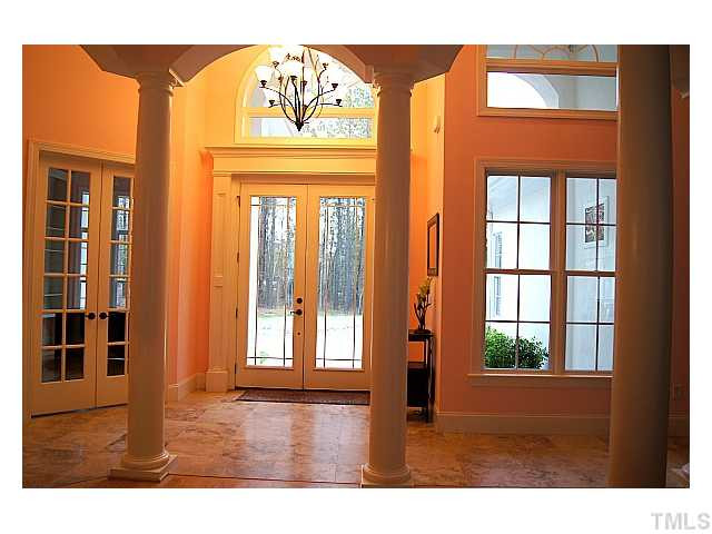 3740 Mason Road New Hill, NC 27562 - Photo 2 of 20 Two-story foyer with Travertine tile floor Foyer