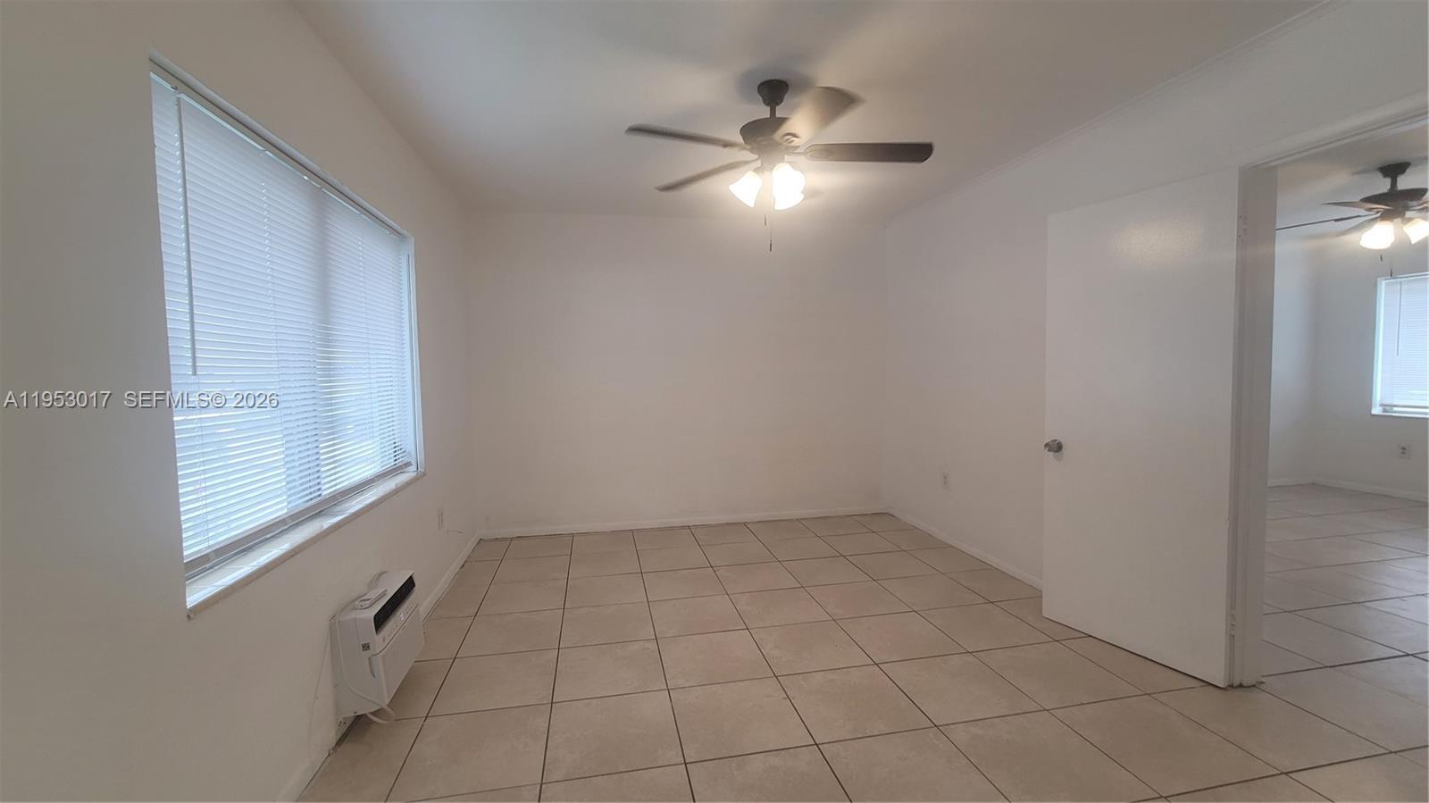 2601 Southwest 22nd Avenue, Unit 11 Miami, FL 33133 - Photo 7 of 10 a view of an empty room with a window