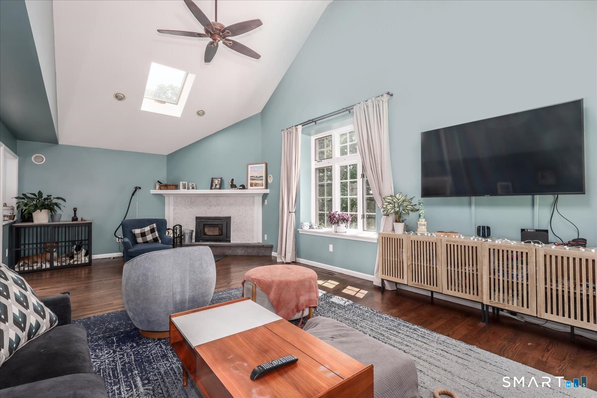 55 A Flax Hill Road Brookfield, CT 06804 - Photo 18 of 40 a living room with furniture a flat screen tv and a window