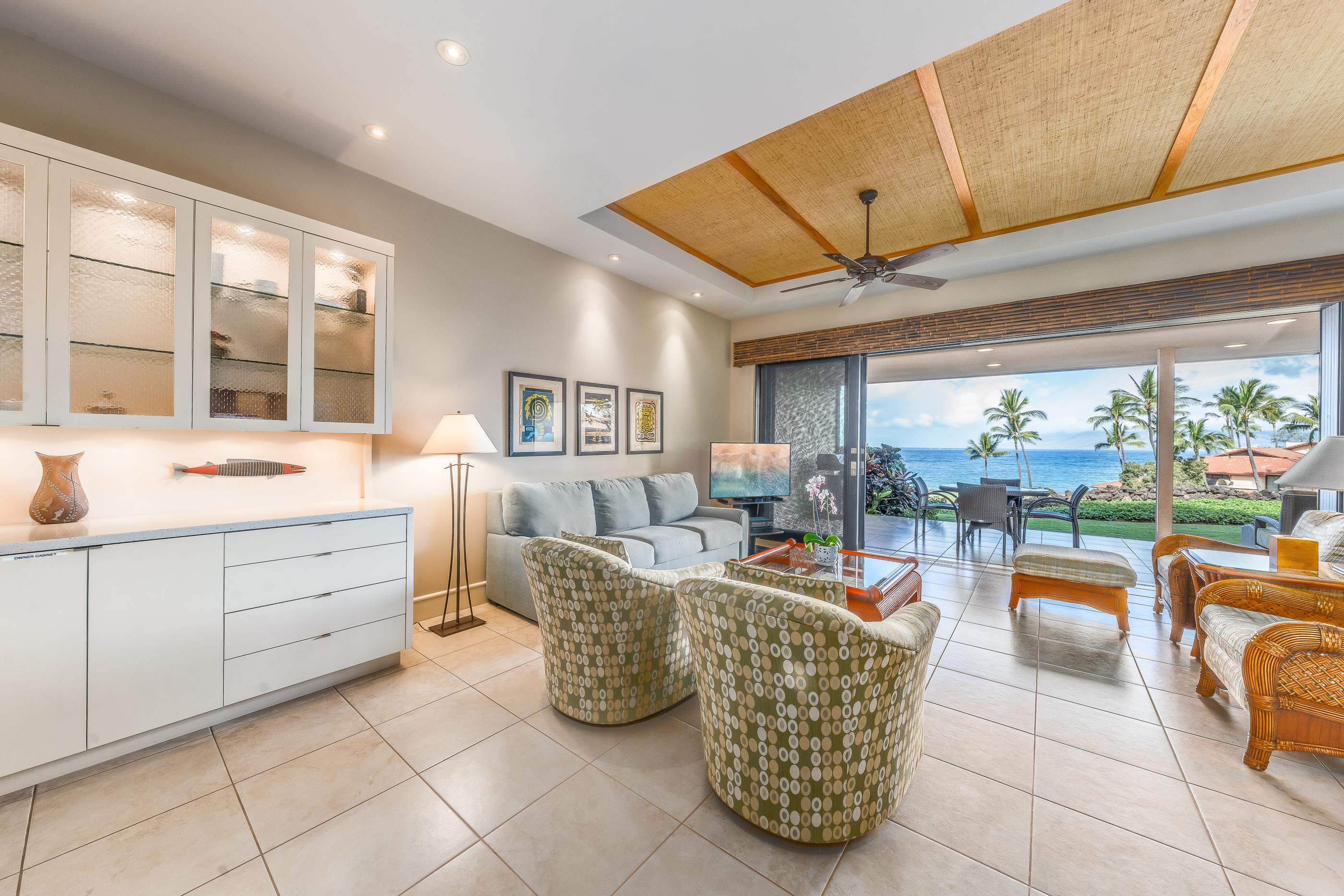 4850 Makena Alanui Road, Unit C106 Kihei, HI 96753 - Photo 12 of 49 a living room with furniture and a large window